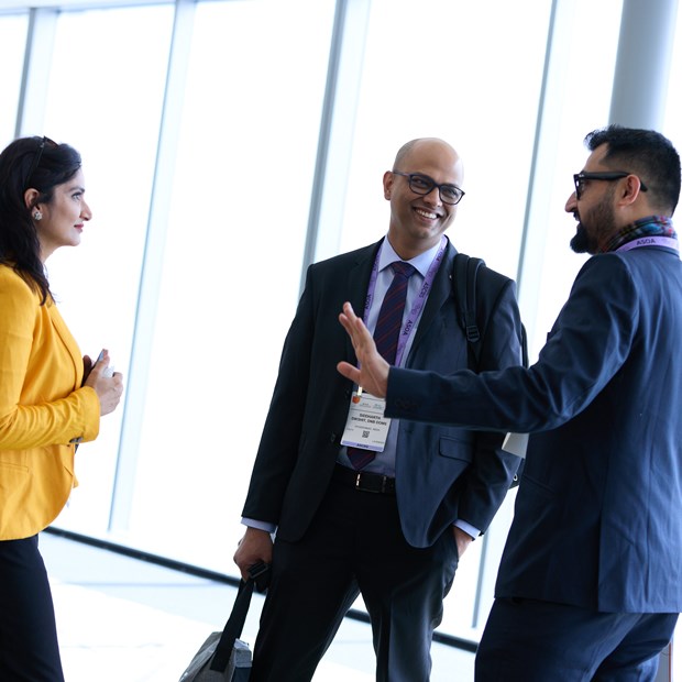 Three members talking in a group