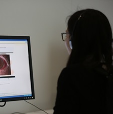 Doctor watching webinar